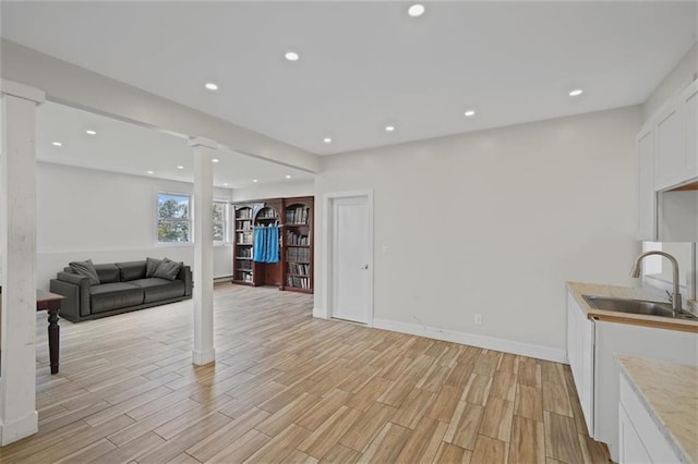 27 Catskill High Rail, Monroe, NY 10950 - living room with ornate columns, light wood-style flooring, recessed lighting, and baseboards