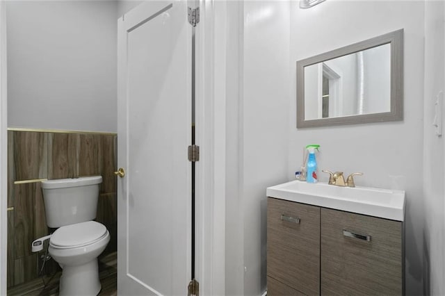 27 Catskill High Rail, Monroe, NY 10950 - bathroom with toilet, vanity, and a wainscoted wall