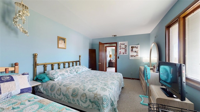 39 Whiting Rd, East Quogue, NY 11942 - bedroom with carpet floors and baseboards