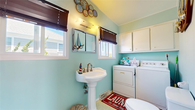 39 Whiting Rd, East Quogue, NY 11942 - half bathroom with toilet, washer and dryer, lofted ceiling, and a sink