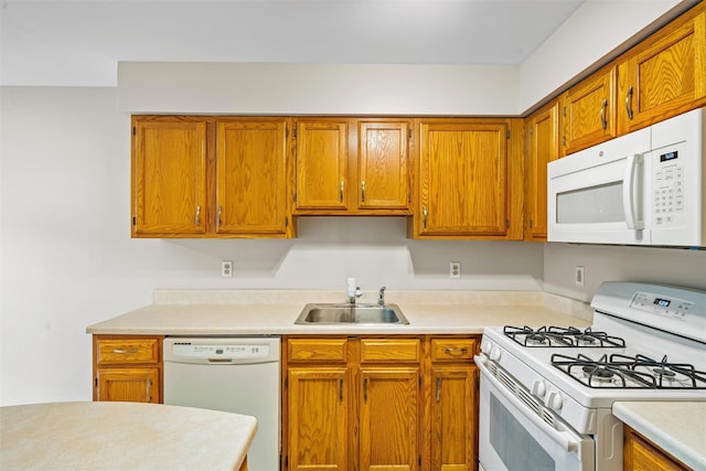 65 Jimal Dr, Middletown, NY 10940 - kitchen with white appliances, a sink, light countertops, and brown cabinets