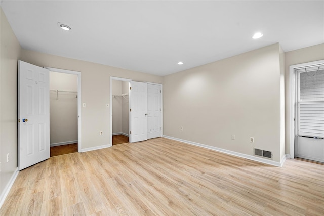 65 Jimal Dr, Middletown, NY 10940 - unfurnished bedroom with baseboards, light wood-style floors, recessed lighting, and a spacious closet
