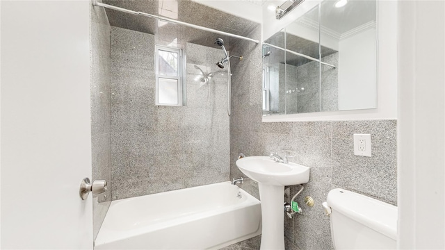 full bath with toilet, tile walls, tub / shower combination, crown molding, and decorative backsplash