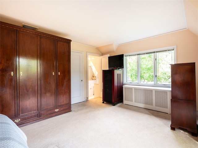 37 Longview Rd, Port Washington, NY 11050 - bedroom featuring vaulted ceiling, light carpet, and ensuite bathroom