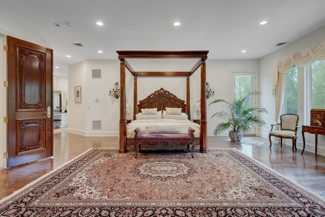 bedroom with light wood-style flooring, recessed lighting, and baseboards