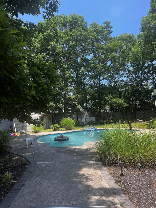 85 Mowbray St, Patchogue, NY 11772 - swimming pool with an outbuilding and a patio area