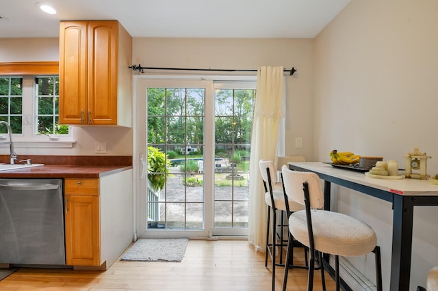 85 Mowbray St, Patchogue, NY 11772 - kitchen featuring stainless steel dishwasher, healthy amount of natural light, light wood-style flooring, and recessed lighting