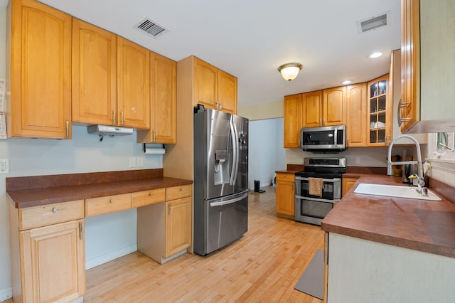 85 Mowbray St, Patchogue, NY 11772 - kitchen with stainless steel appliances, light wood finished floors, dark countertops, and recessed lighting