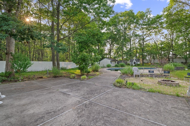 85 Mowbray St, Patchogue, NY 11772 - view of patio featuring a fire pit and an outdoor structure