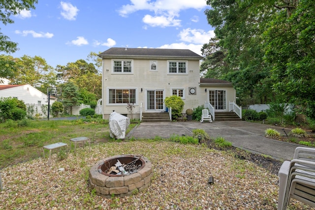 85 Mowbray St, Patchogue, NY 11772 - rear view of house featuring an outdoor fire pit, a patio area, and entry steps