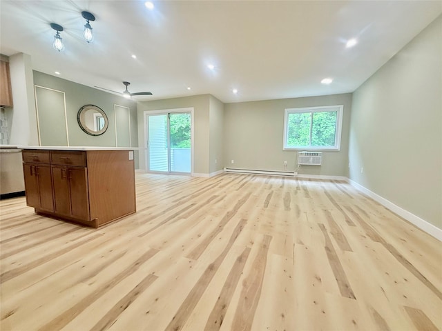 unfurnished living room with a baseboard radiator, plenty of natural light, light wood-style floors, baseboards, and recessed lighting