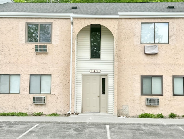 view of property with uncovered parking