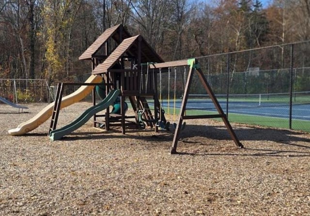 community jungle gym featuring fence