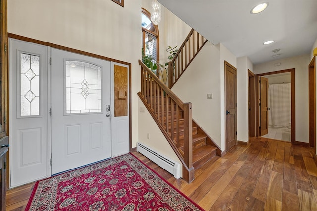 216 Cortese Rd, Call Listing Agent, PA 18405 - entrance foyer featuring a baseboard heating unit, stairs, hardwood / wood-style floors, baseboards, and recessed lighting