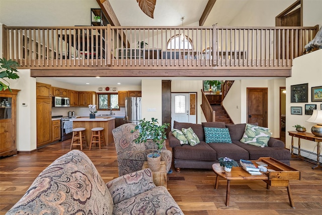 216 Cortese Rd, Call Listing Agent, PA 18405 - living area with a towering ceiling, plenty of natural light, dark wood-type flooring, and stairs