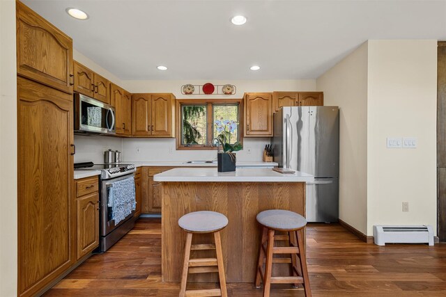 216 Cortese Rd, Call Listing Agent, PA 18405 - kitchen featuring appliances with stainless steel finishes, a baseboard radiator, a sink, dark wood-style floors, and a center island