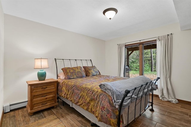 216 Cortese Rd, Call Listing Agent, PA 18405 - bedroom featuring a baseboard heating unit, access to exterior, wood finished floors, and baseboards