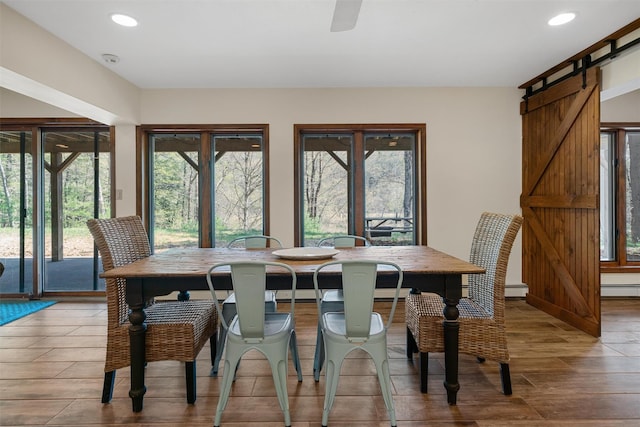 216 Cortese Rd, Call Listing Agent, PA 18405 - dining area featuring a barn door, healthy amount of natural light, recessed lighting, wood finished floors, and baseboard heating