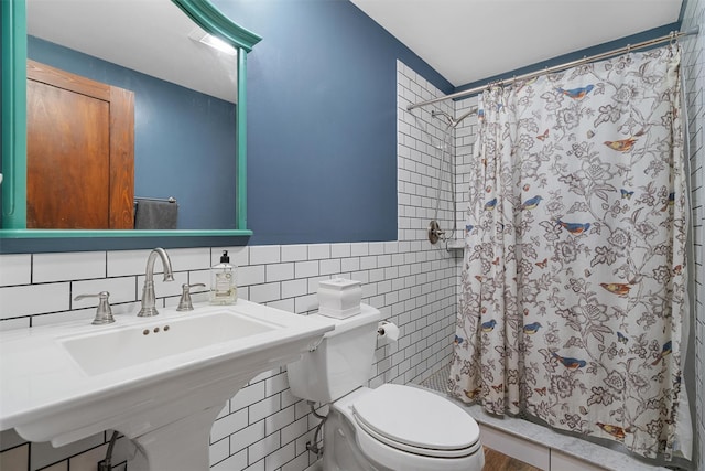216 Cortese Rd, Call Listing Agent, PA 18405 - bathroom featuring tile walls, a shower stall, toilet, and a sink
