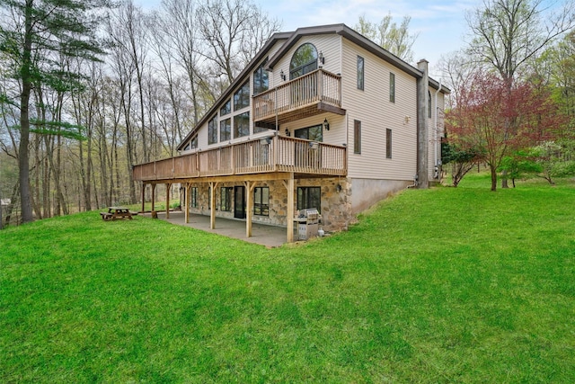 216 Cortese Rd, Call Listing Agent, PA 18405 - rear view of property featuring a yard, a patio area, a balcony, a chimney, and a wooden deck