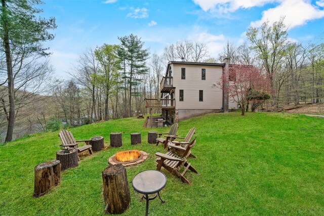 216 Cortese Rd, Call Listing Agent, PA 18405 - view of green lawn with an outdoor fire pit and a wooden deck