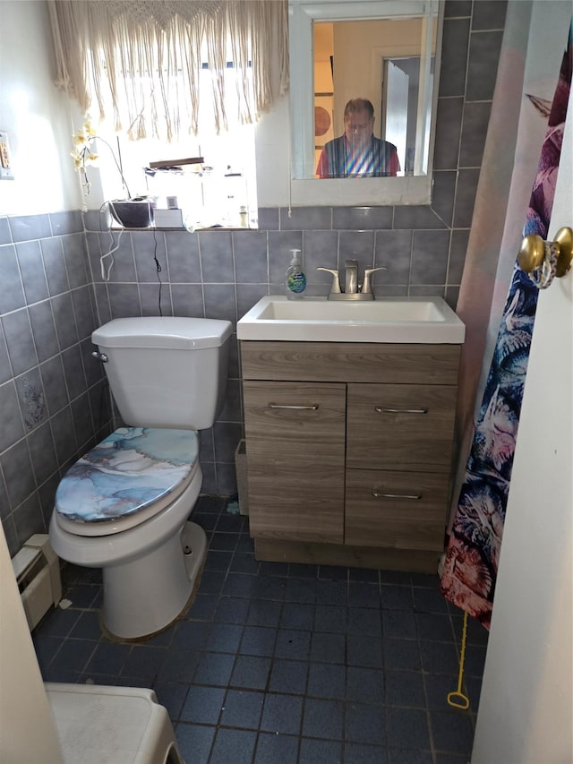 163 Villa Ave, Yonkers, NY 10704 - full bath with tile walls, a baseboard radiator, tile patterned flooring, toilet, and vanity