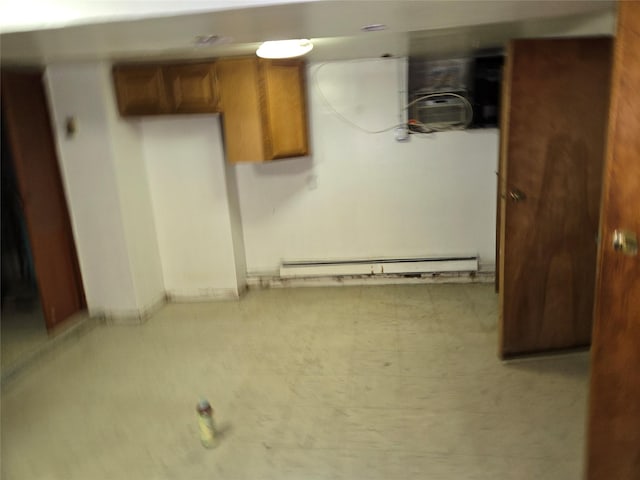 163 Villa Ave, Yonkers, NY 10704 - basement featuring a baseboard heating unit