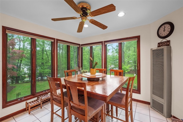 dining area with a heating unit, a ceiling fan, baseboards, light tile patterned flooring, and recessed lighting