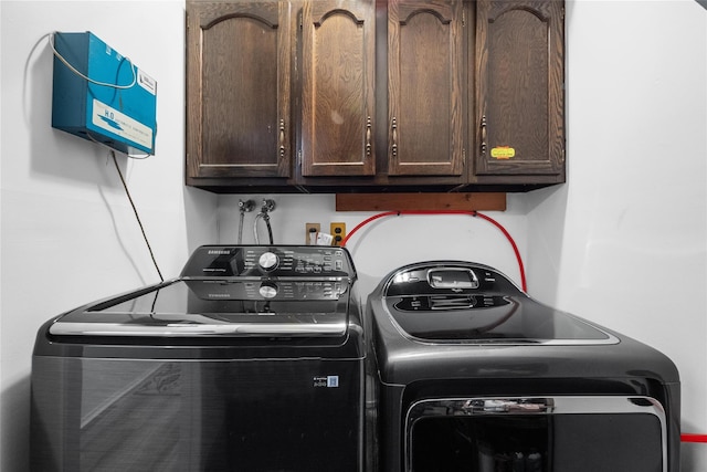 laundry area with cabinet space and washer and dryer