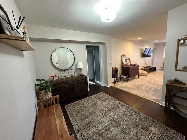 foyer entrance with wood finished floors, recessed lighting, and baseboards