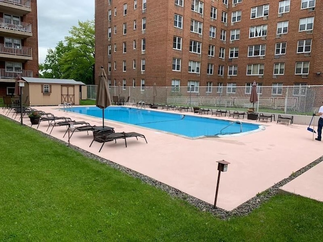 community pool featuring a patio area