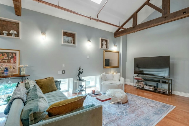 living room with wood finished floors and baseboards
