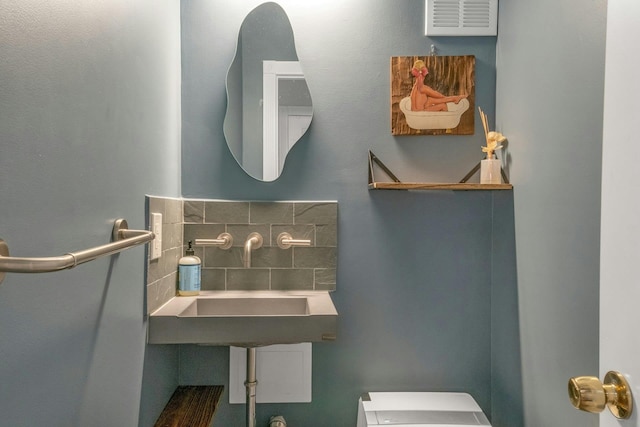 bathroom featuring a sink and toilet