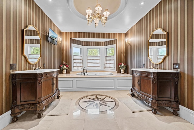 full bathroom with wallpapered walls, plenty of natural light, a chandelier, a bath, and two vanities
