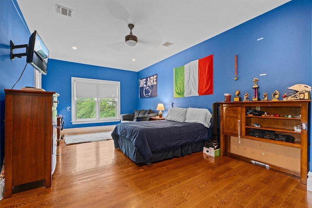 bedroom featuring wood finished floors and a ceiling fan