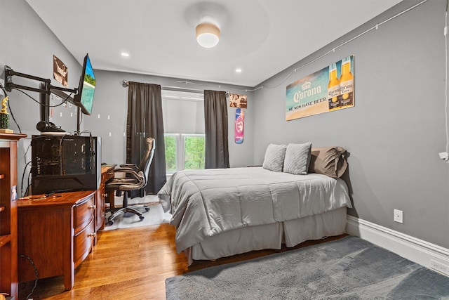 bedroom featuring recessed lighting, baseboards, and wood finished floors