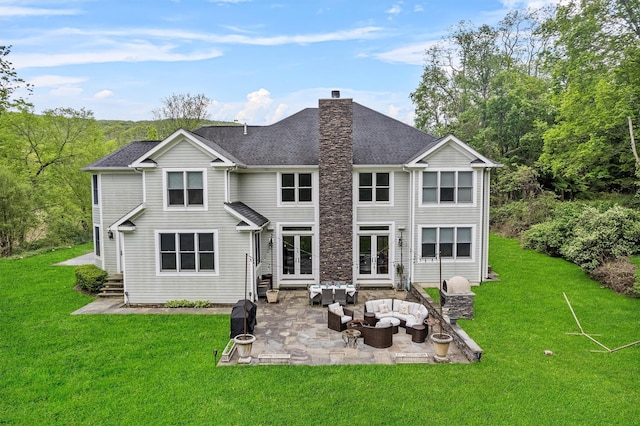 rear view of property featuring an outdoor living space, french doors, a patio, a chimney, and a yard