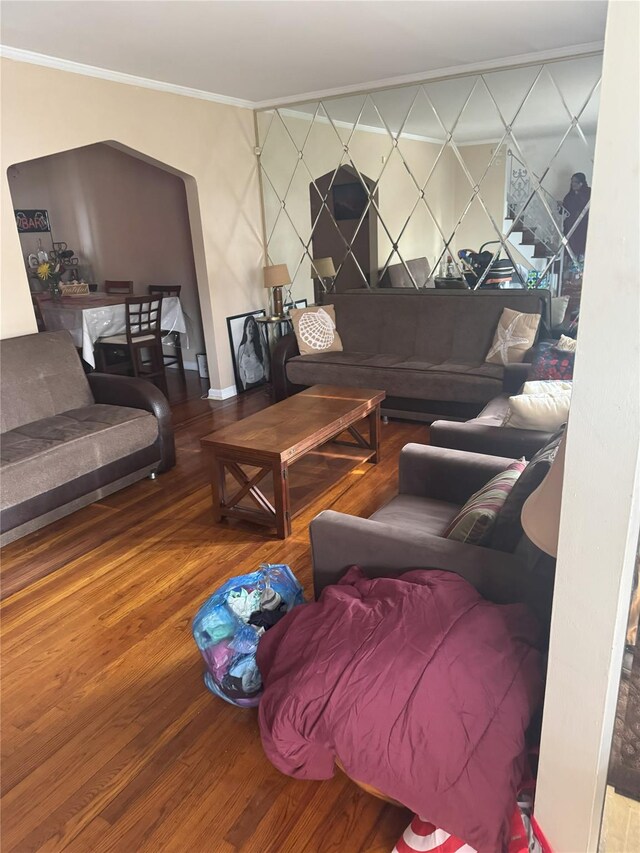 11568 229th St, Cambria Heights, NY 11411 - living area featuring wood finished floors, crown molding, and baseboards