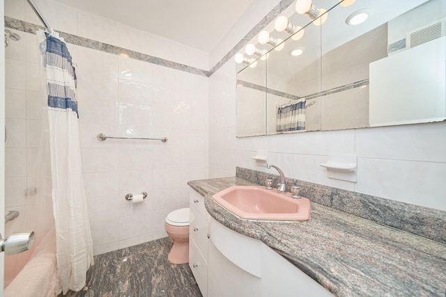 6629 74th St, Middle Village, NY 11379 - bathroom with tile walls, toilet, vanity, and a shower with shower curtain