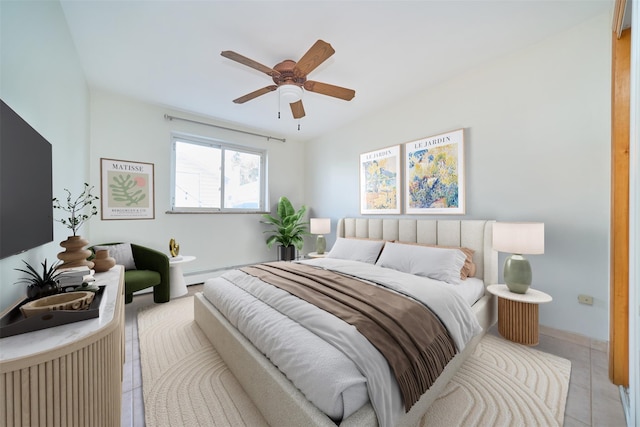 6629 74th St, Middle Village, NY 11379 - bedroom featuring light tile patterned floors, ceiling fan, baseboards, and a baseboard radiator