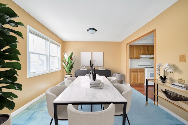 6629 74th St, Middle Village, NY 11379 - dining area featuring baseboards and light colored carpet