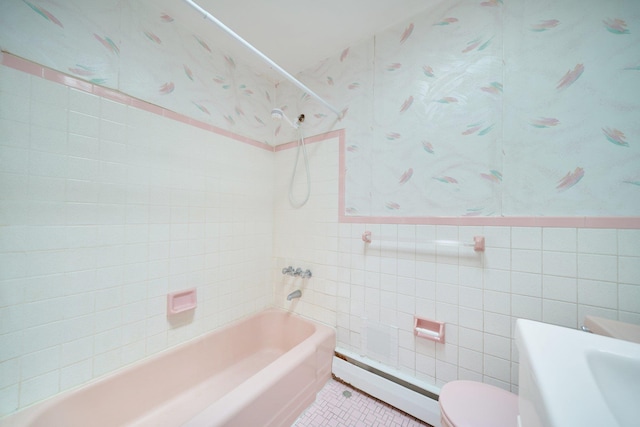 6629 74th St, Middle Village, NY 11379 - bathroom featuring a baseboard heating unit, tile walls, bathing tub / shower combination, tile patterned floors, and toilet