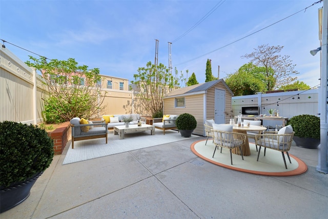 6629 74th St, Middle Village, NY 11379 - view of patio with an outdoor living space, a fenced backyard, an outdoor structure, a shed, and outdoor dining space