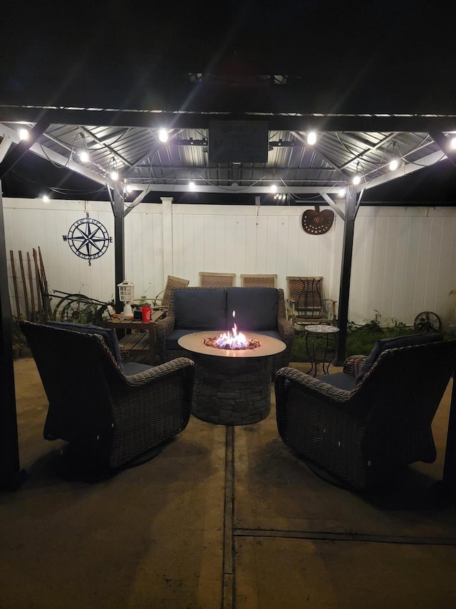 53 Bayview Ave, East Islip, NY 11730 - patio at night featuring an outdoor fire pit and fence