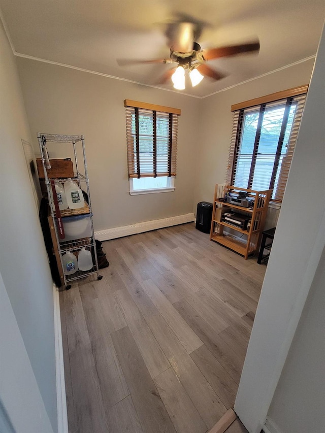 53 Bayview Ave, East Islip, NY 11730 - home office featuring a ceiling fan, healthy amount of natural light, wood finished floors, and baseboards