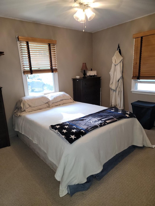 53 Bayview Ave, East Islip, NY 11730 - carpeted bedroom featuring multiple windows, crown molding, and ceiling fan