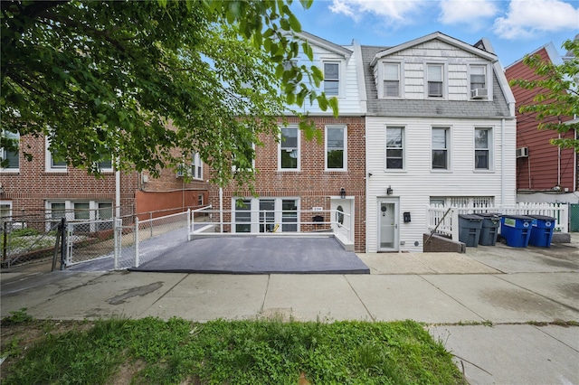 234 Quincy Ave, Bronx, NY 10465 - back of house featuring a patio area, brick siding, and a gate