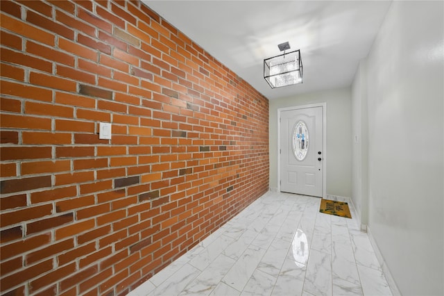 234 Quincy Ave, Bronx, NY 10465 - doorway to outside featuring brick wall, light marble finish floors, and baseboards