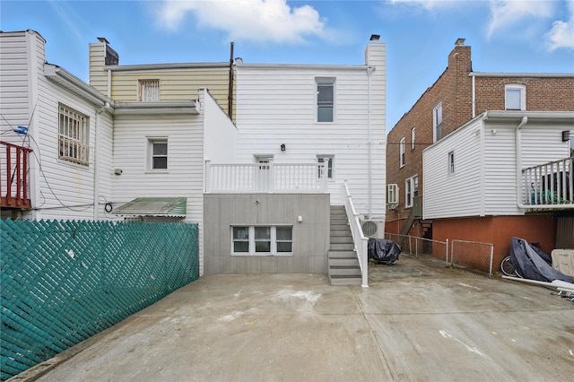 234 Quincy Ave, Bronx, NY 10465 - rear view of house with stairs and a patio area