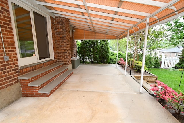 view of patio / terrace featuring entry steps and fence